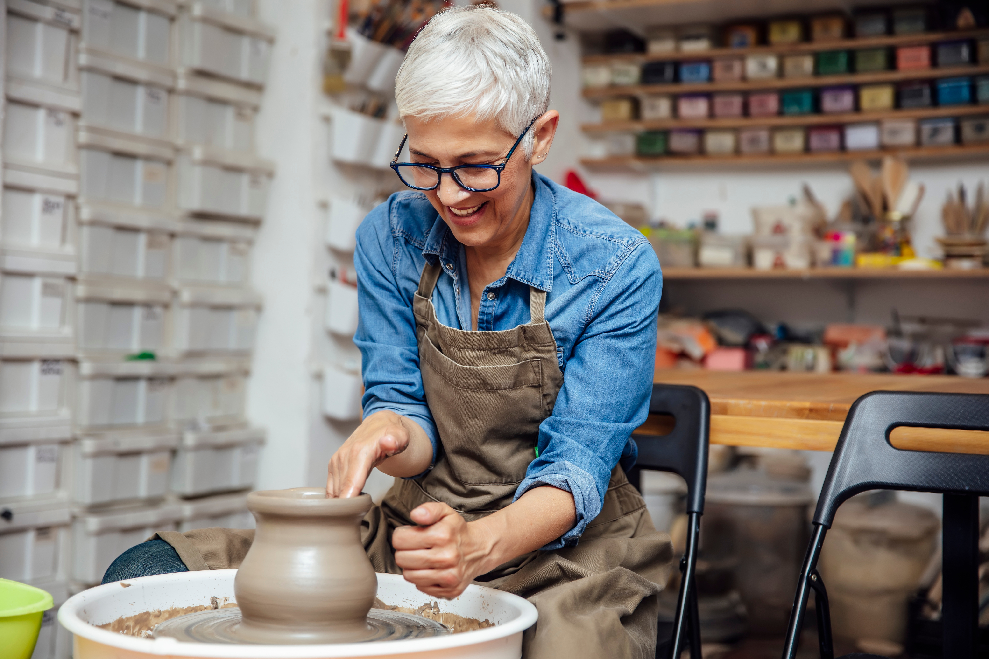 A smiling member enjoying a creative everyday activity